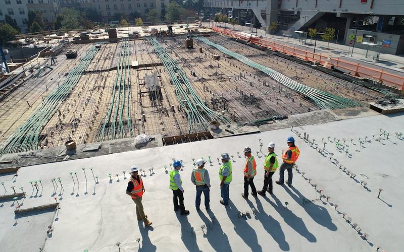 Construction team reviewing a reinforced concrete deck
